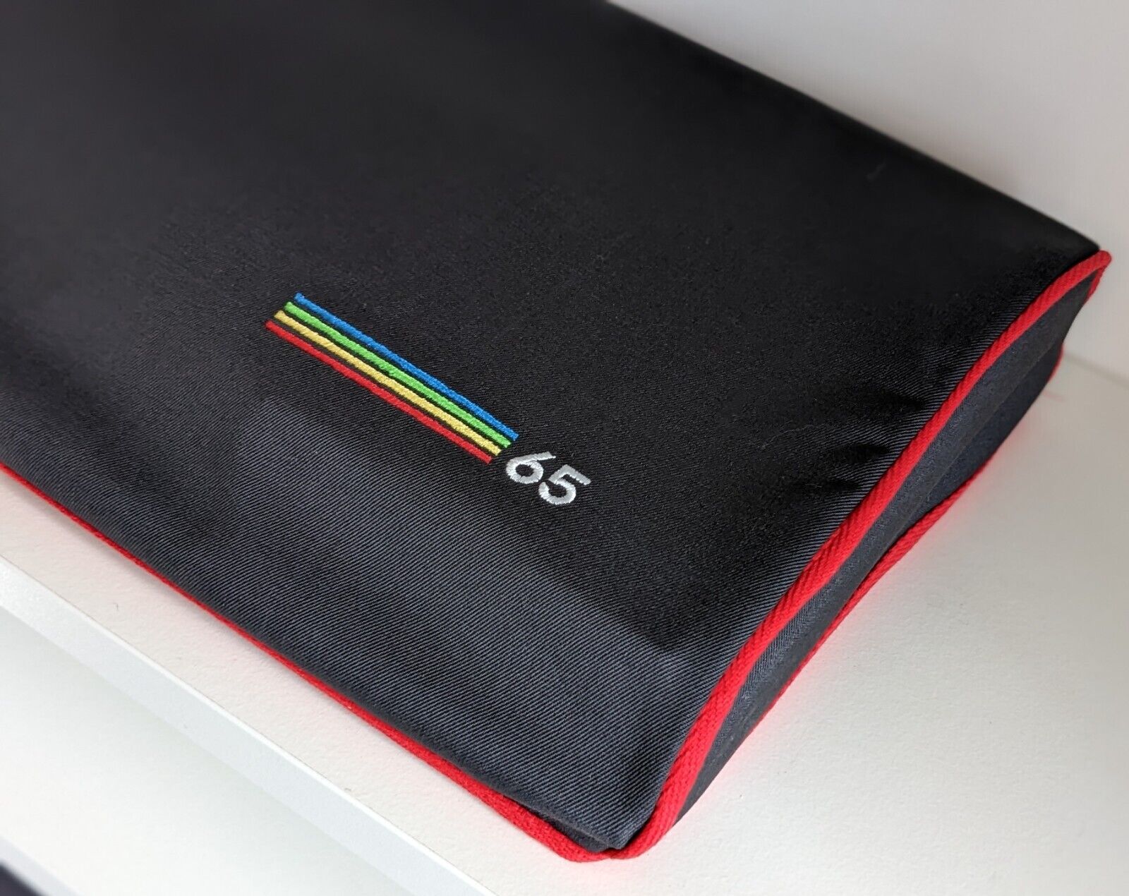 An embroidered dust cover for the MEGA65, by Sew Ready