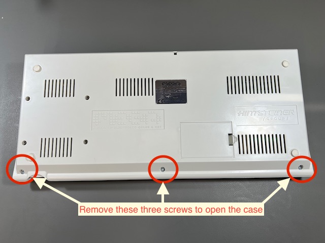 The bottom of the MEGA65 with three screws for opening the case