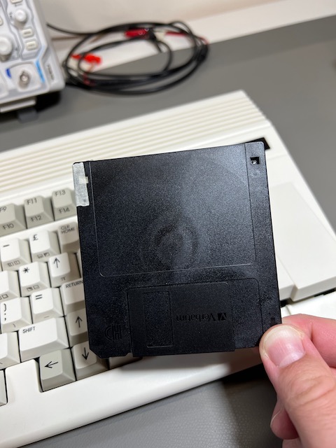 An HD disk with masking tape over the HD indicator hole