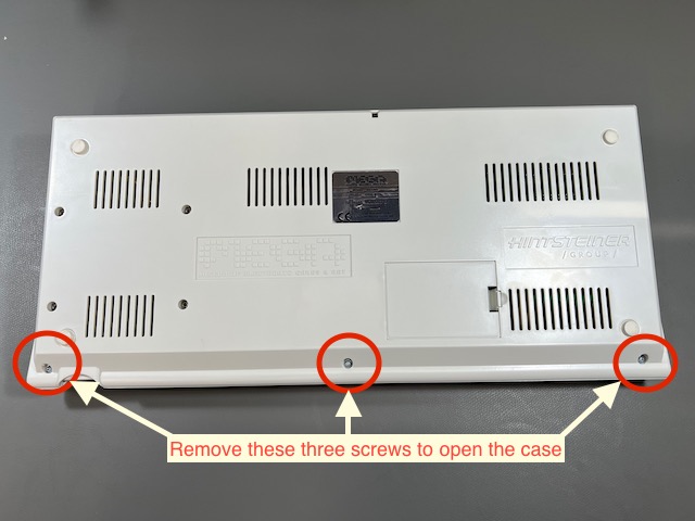 The bottom of the MEGA65 with three screws for opening the case
